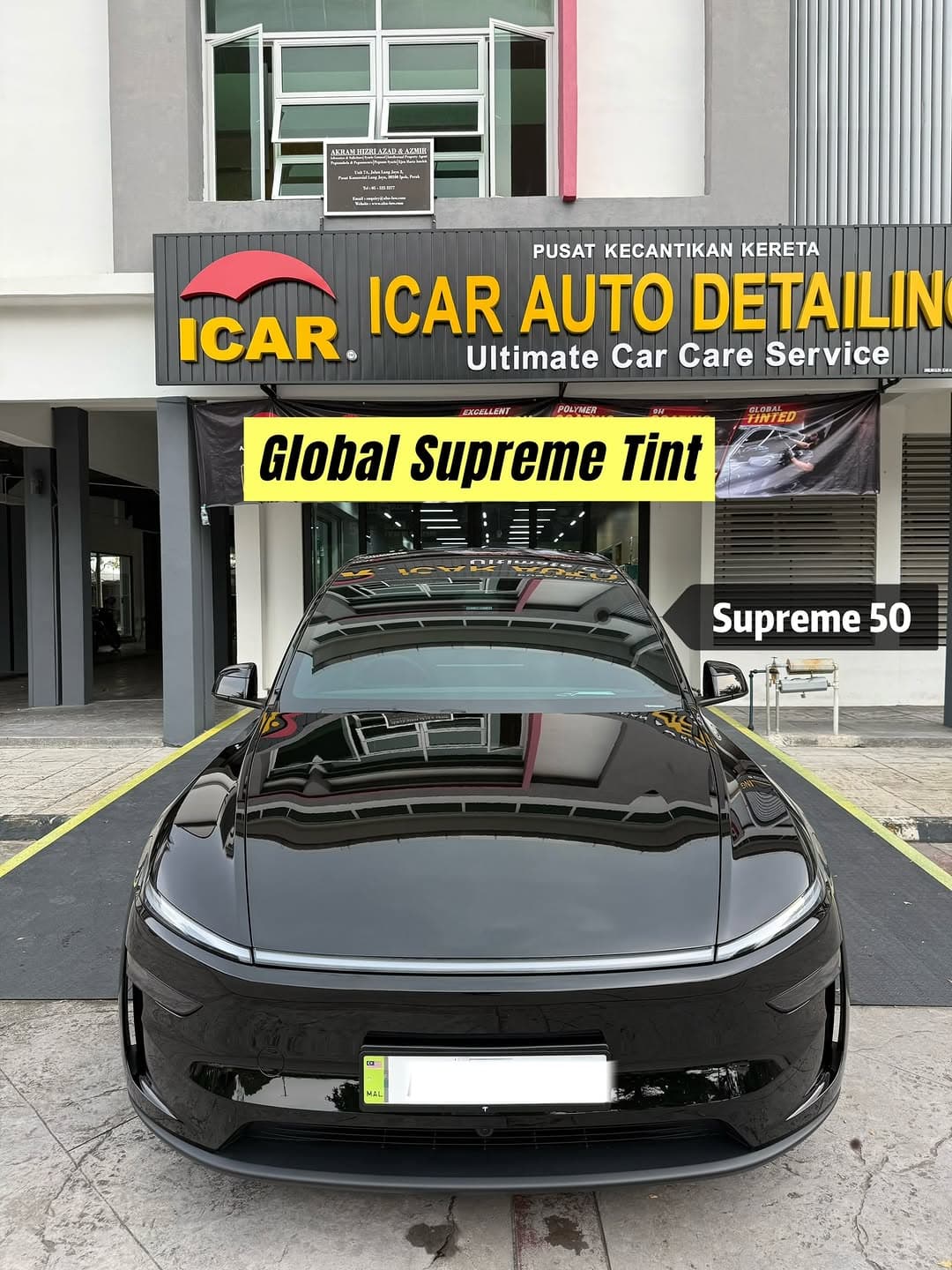 A black Tesla Model Y L outside the ICAR shopfront after a Global IR Supreme tint